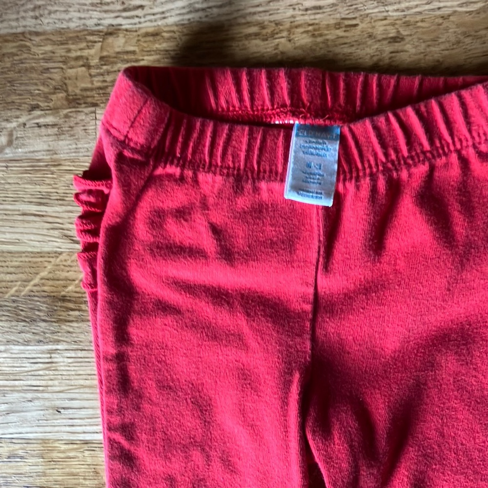 2 pair of pants 0-3 month red pair is old navy black pair are Garanimal0-3 month